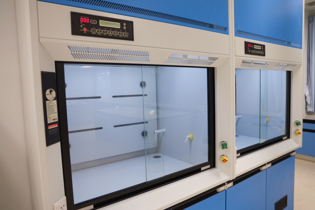 Laboratory fume hoods in science classroom interior of university college for protect the user from inhaling toxic gases (fume hoods, biosafety cabinets, glove boxes).
